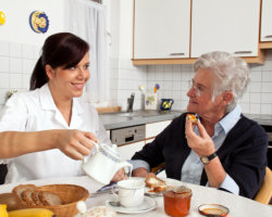 caregiver and patient having meal